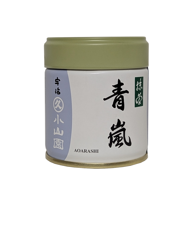 Cylindrical container with a green lid and white label featuring black text on a white background