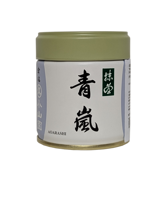 Tea canister with Japanese text on a white background