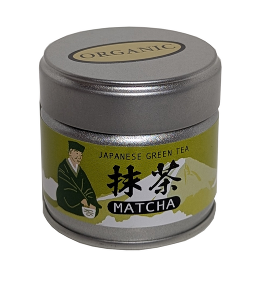 Silver tin of Japanese green tea matcha with a label featuring a person in traditional attire.